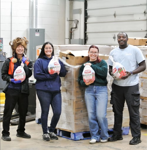 Volunteers distributing turkeys for Feeding Winchester charity event