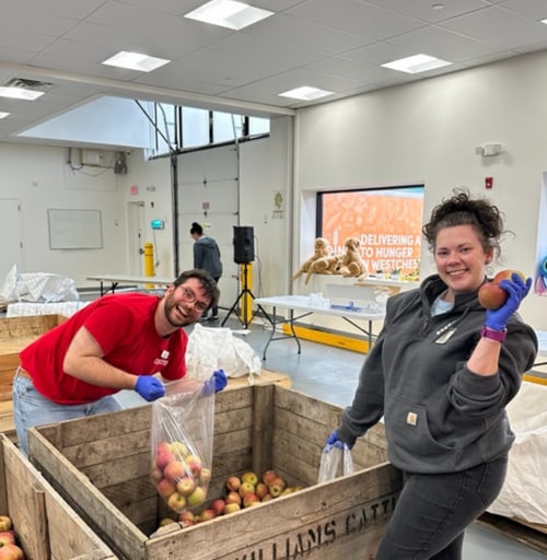 Volunteers packing food for the Feeding Winchester charity program